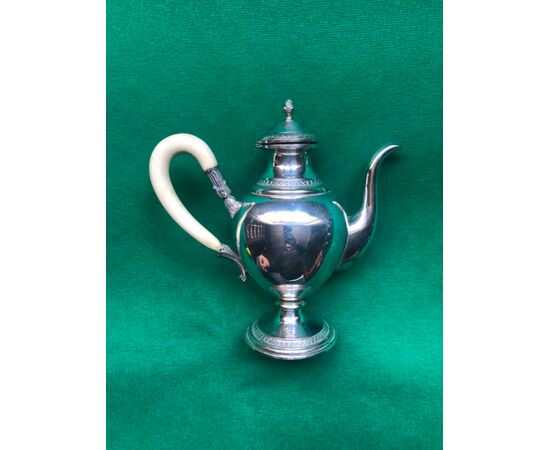 Silver coffeepot with stylized vegetal and geometric decorations, ivory handle Italy, Lictorian fasces hallmark.     