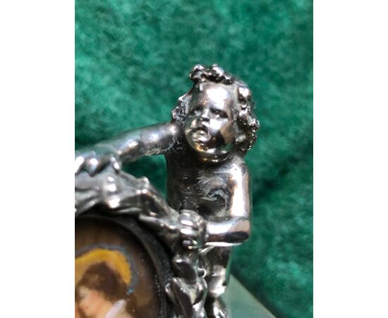 Silver press-papier paperweight with two cherubs and picture frame with miniature in ivory. Blackboard stone base.     