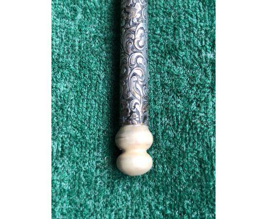 Silver pen with leaf swirl decorations. Ivory detail.     