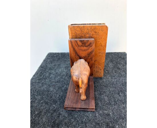 Pair of rosewood bookends depicting elephants with ivory tusks.     