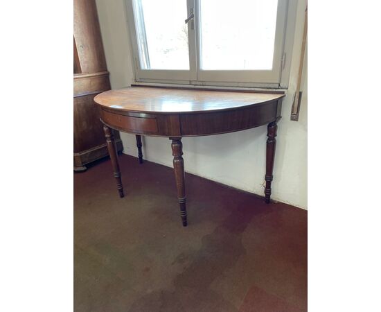 Crescent console in mahogany with turned legs and central drawer