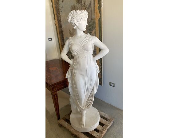 White Carrara marble statue depicting a female figure     