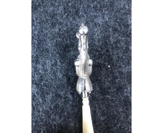 Silver baby rattle depicting a jester. Ivory handle.Europe.     