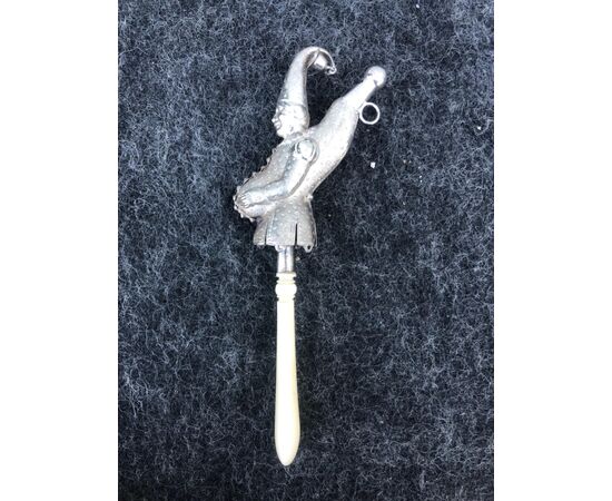 Silver baby rattle depicting a jester. Ivory handle.Europe.     
