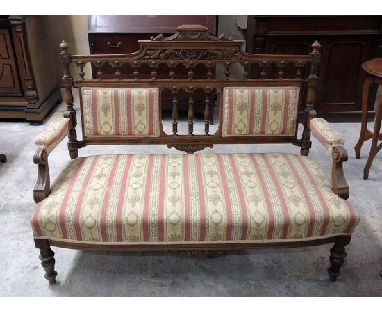 Details on Mahogany sofa with English Victorian sculpture works
