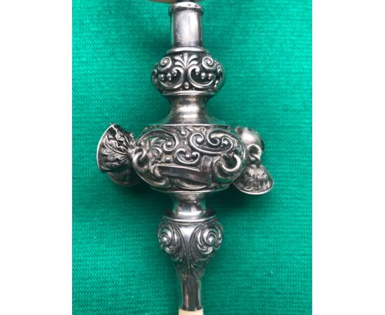 Silver baby rattle with stylized plant motifs.Ivory handle and ring.Birmingham 1904.England.     