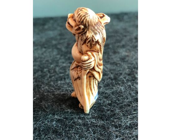 Netsuke &#39;in ivory depicting demon with frog.Japan     