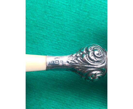 Silver baby rattle with stylized plant motifs.Ivory handle and ring.Birmingham 1904.England.     