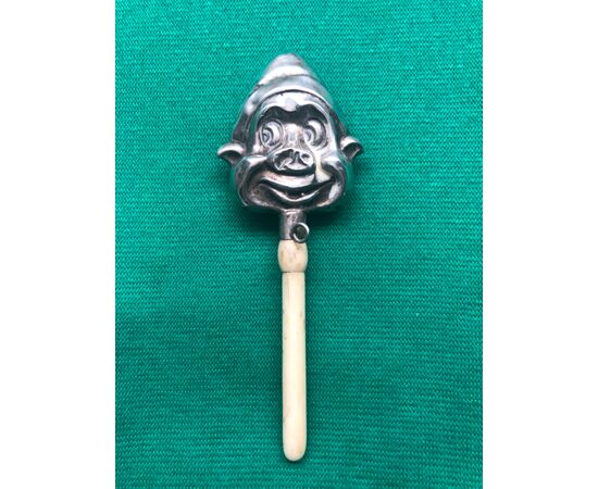 Silver baby rattle with jester&#39;s face. Ivory handle. Italy.     