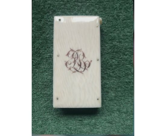 Ivory matchbox with engraved initials.     
