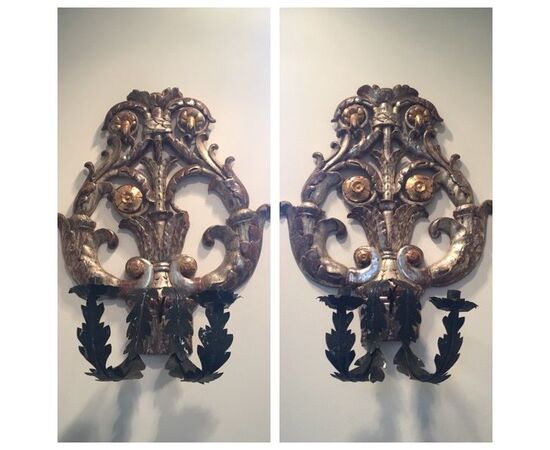 Pair of appliques in silver mecca wood and gold leaf gilded with arms in two-candle iron sheet.     