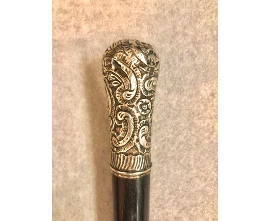 Evening stick with silver knob with rocaille decoration.     
