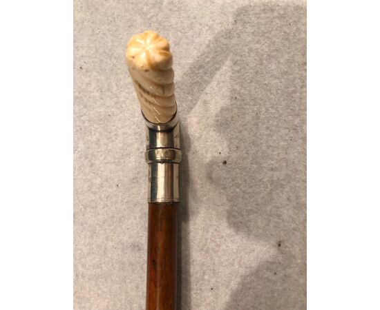 Stick with ivory and animated metal knob with a lighter.     