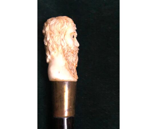 Stick with bone knob depicting male character with beard.Germany.     