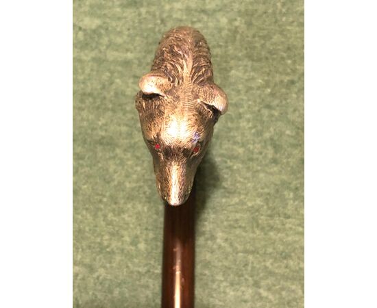 Stick with solid silver pommel depicting a dog&#39;s head. Ruby eyes. Rosewood barrel. Italian punch.     
