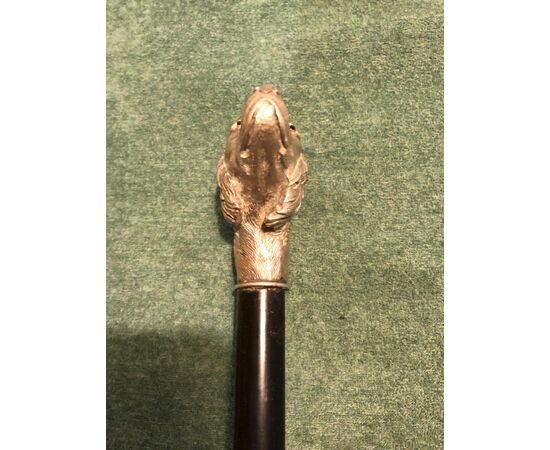 Stick with solid silver knob representing a dog&#39;s head. Ebony barrel. Italy.     