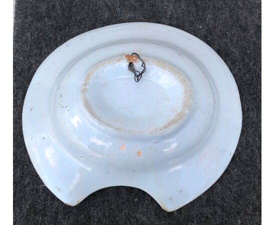 Oval shaving plate with stylized floral decoration.France.     