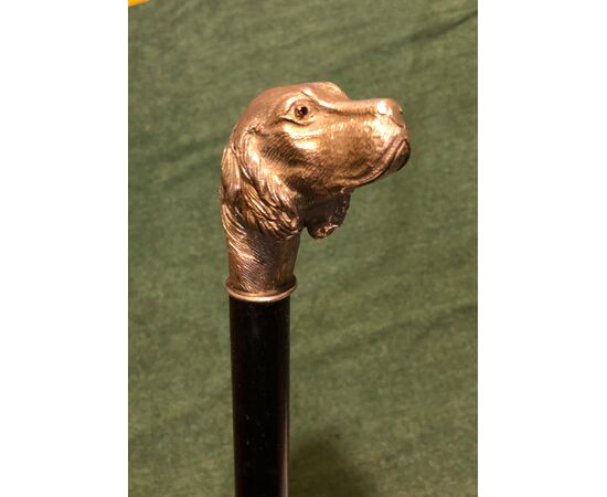 Stick with solid silver knob representing a dog&#39;s head. Ebony barrel. Italy.     