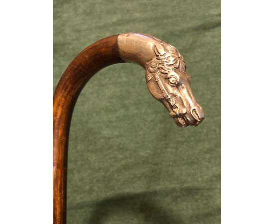 Stick with silver knob depicting horse head.Italy.     