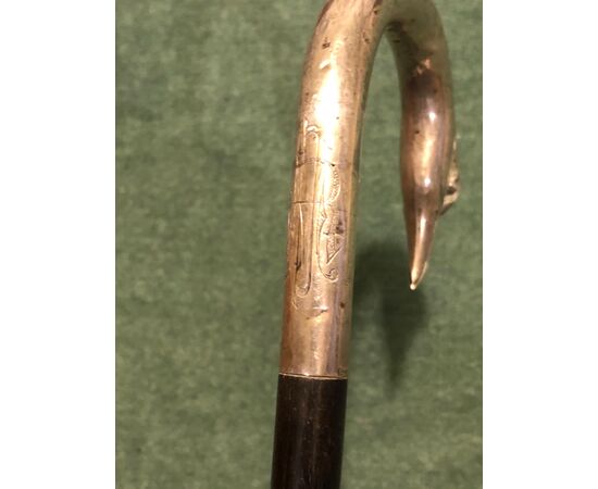 Silver stick with handle depicting a bird&#39;s head.     