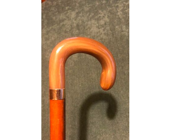 Stick with horn knob and low gold ring.     