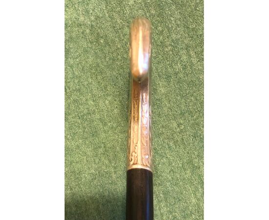 Stick with silver handle and ebony barrel.     