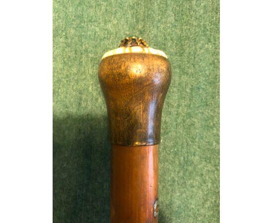 Stick with horn and ivory knob with hard stone.     