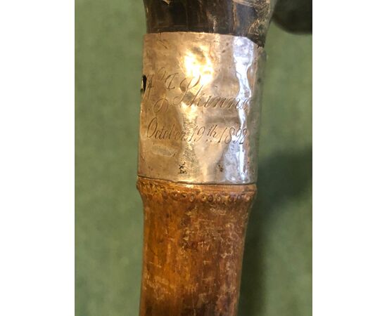 Stick with horn handle with whistle and dog&#39;s head. Engraved date.     