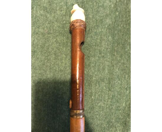 &#39;Flute&#39; stick, in bone and leather. Barrel in rattan.     