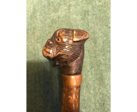 Glove-stick with wooden knob depicting a dog&#39;s head. Rosewood barrel.     