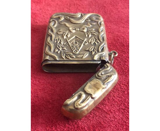 Brass matchbox with Masonic symbols.     