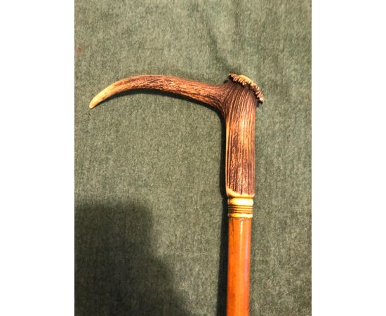 Stick with deer horn knob and rattan cane.     