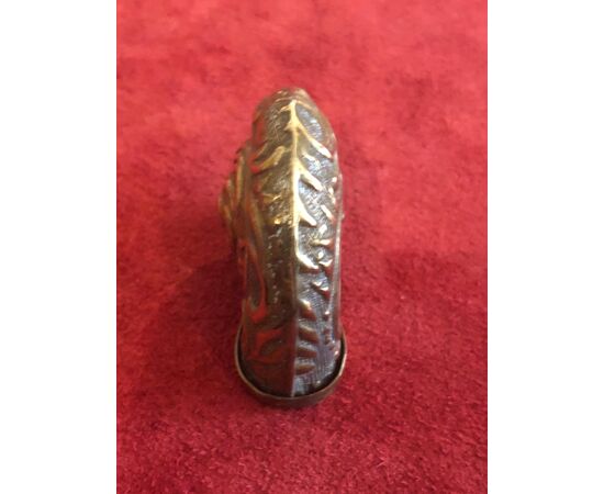 Brass matchbox in the shape of a shell with rocaille motifs.     