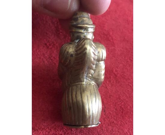 Brass matchbox with a humped jester.     