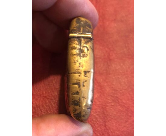 Cigar-shaped brass matchbox.     