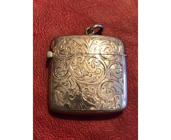 Silver matchbox with rocaille decoration with NV initials England.     