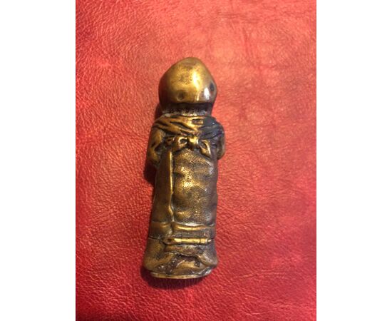 Brass matchbox in the shape of an infant child.     