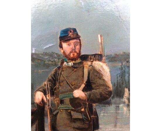 Dipinto olio su cartoncino con figura di soldato su sfondo agreste.Firma:Eraud