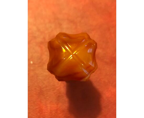 Carnelian seal with engraved initials.     