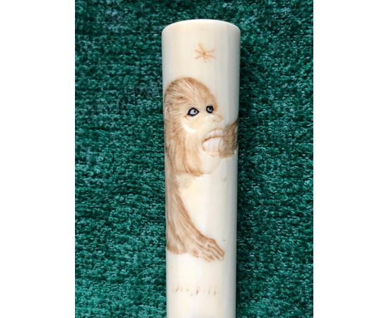 Small ivory mouthpiece engraved with a monkey figure. Japan.     