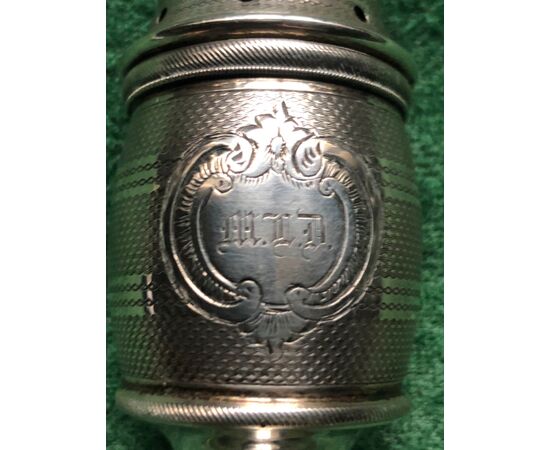 Silver sugar spreader with knurled pattern and shield with engraved initials. (Without hallmark)     