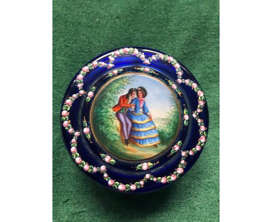 Cased and ground crystal box with enamel decorations of a floral subject and a gallant scene. France.     