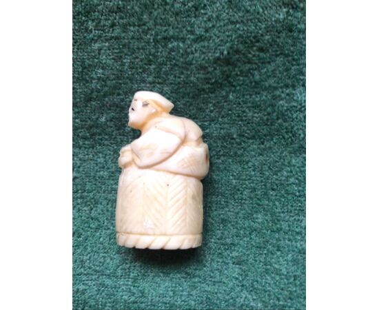 Ivory netsuke &#39;with character sitting on a wicker basket. Japan.     
