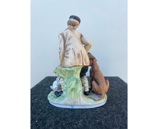 Polychrome porcelain group depicting a comic scene with a hunter.Giuseppe Cappe &#39;. (unsigned).     