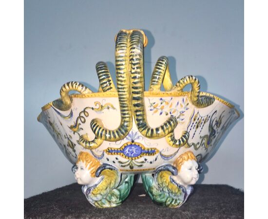 Majolica centerpiece with snake-shaped sockets and feet in the shape of angels. Raphaelesque and grotesque decoration. Cantagalli manufacture. Florence.     