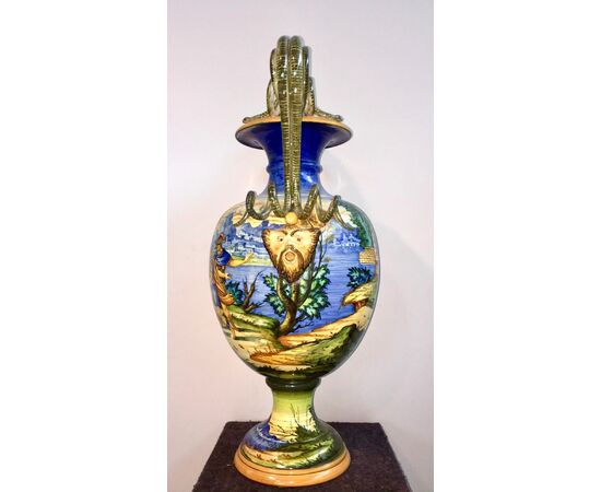 Large majolica vase with snake and mascaron handles and historiated decoration.Molaroni manufacture, Pesaro.     