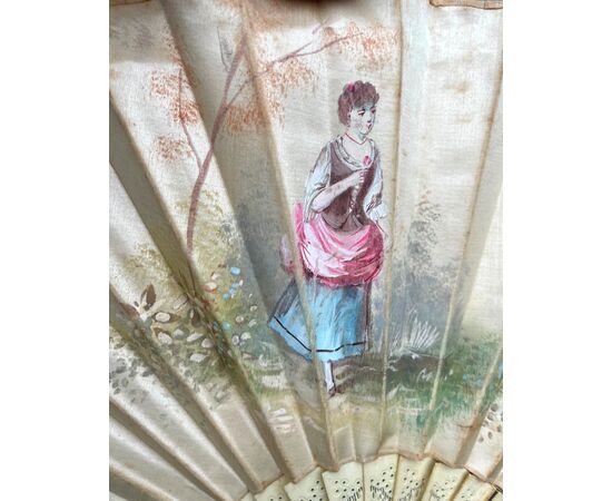 Fan with bunting in silk painted with a female figure. Slats in pierced ivory. France.     