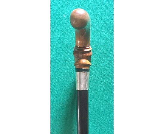 Walking stick with knob depicting a male figure with boxwood beard, silver ferrule and rosewood barrel.     