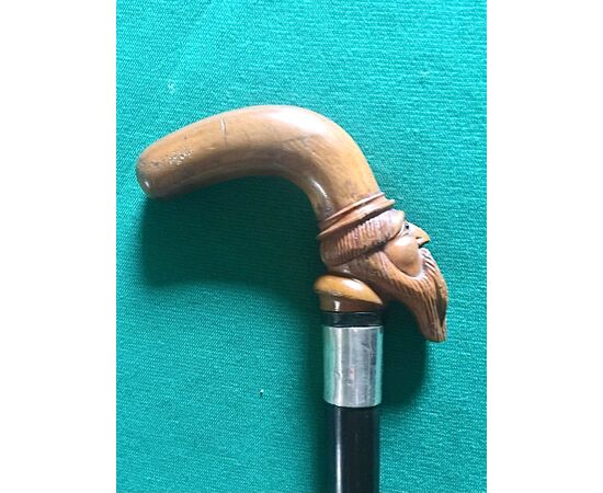 Walking stick with knob depicting a male figure with boxwood beard, silver ferrule and rosewood barrel.     