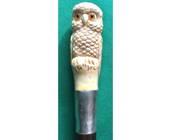 Walking stick with deer horn knob depicting an owl, silver ferrule.     